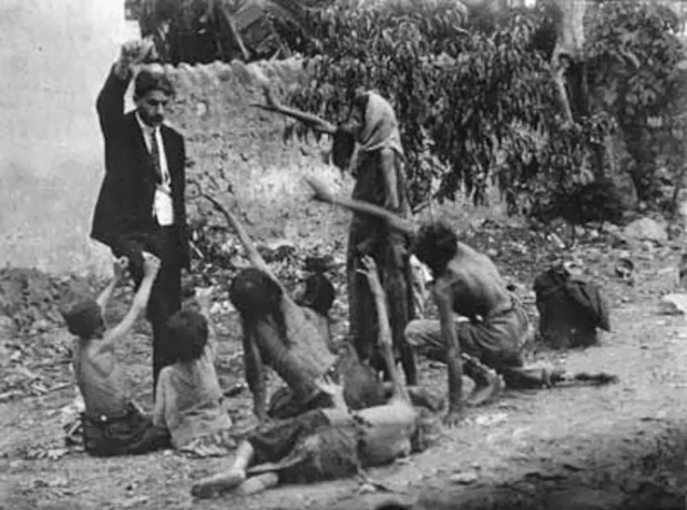 Turkish-official-teases-starving-Armenian-children-by-showing-them-a-piece-of-bread-during-the-Armenian-Genocide-in-1915