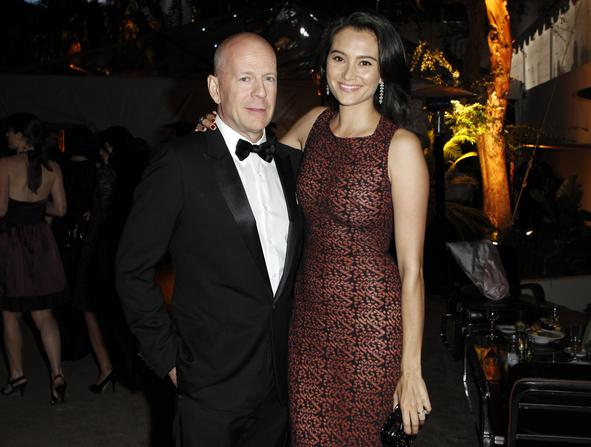 Actor Bruce Willis (L) and his wife Emma Heming pose at The Weinstein Company and Relativity Media's after party for the 68th annual Golden Globe Awards in Beverly Hills, California January 16, 2011. Reuters/Danny Moloshok (UNITED STATES - Tags: ENTERTAINMENT PROFILE) (GOLDENGLOBES-PARTIES)